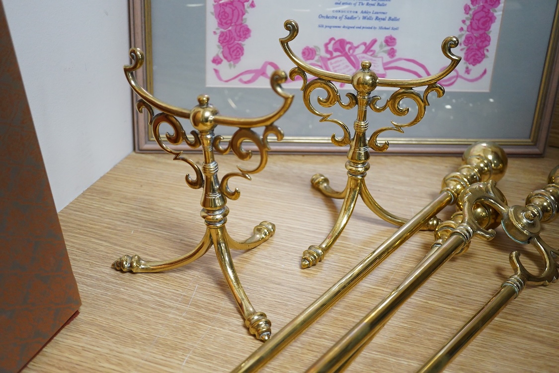 Three brass andirons and two trivets